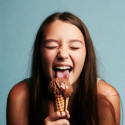 Girl eating chocolate ice cream cone