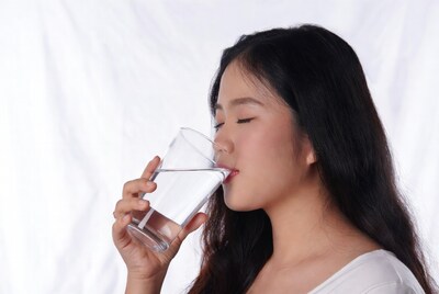 Asian woman drinking water