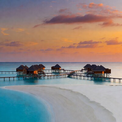 Overwater bungalows at sunset