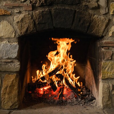 Blazing fire in stone fireplace
