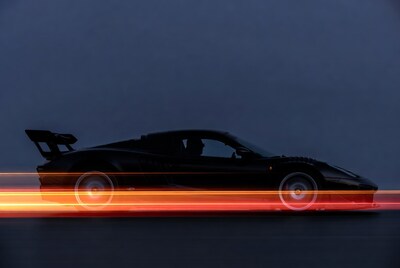 Black Supercar with Wing in Motion Blur