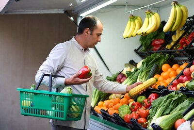 Man shopping vegetables at market