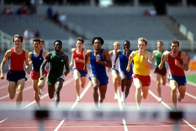 Men sprinting across finish line