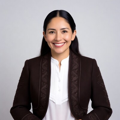 Smiling Latina woman in embroidered blazer