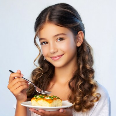 Girl eating cheesecake with fork