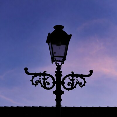 Vintage street lamp silhouette at dusk