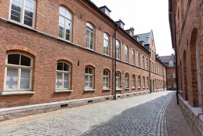 Brick Buildings Along Cobblestone Alley