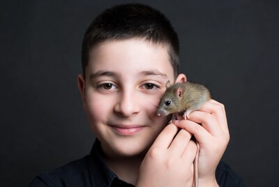 Boy holding pet mouse