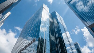 Modern glass skyscrapers against blue sky