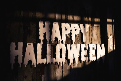Dripping Happy Halloween Sign on Wood