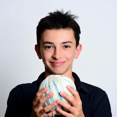 Boy holding yarn ball