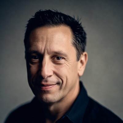 Smiling man in black shirt