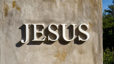 Jesus Sign on Textured Wall
