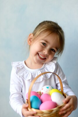 Girl holding Easter eggs basket