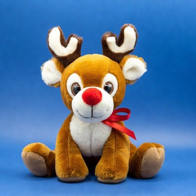 Rudolph Reindeer Plush Toy on Blue Background