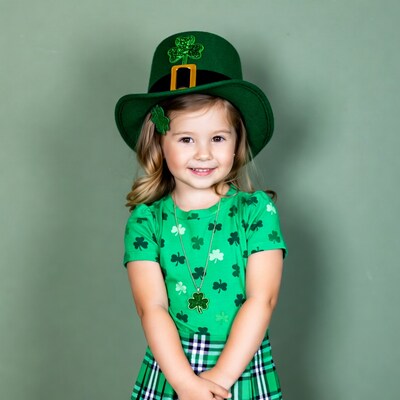 Girl in leprechaun hat smiling