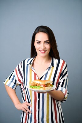 Woman holding chicken burger plate