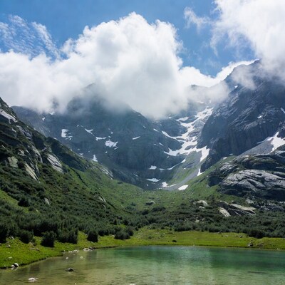 Alpine lake amid snowy mountains