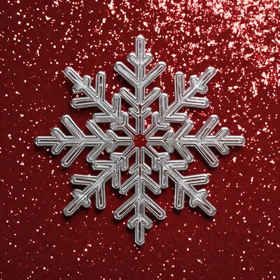 Silver snowflake on red glitter background