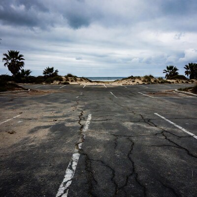 Empty Cracked Beach Parking Lot
