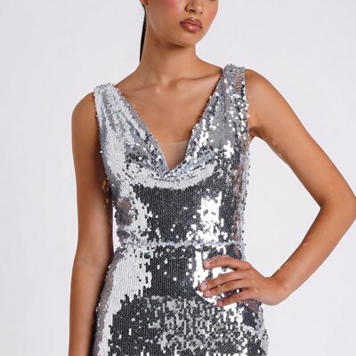 Asian woman in silver sequin dress