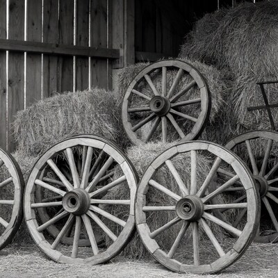 Old wagon wheels and hay bales