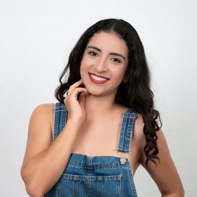 Smiling woman in denim overalls