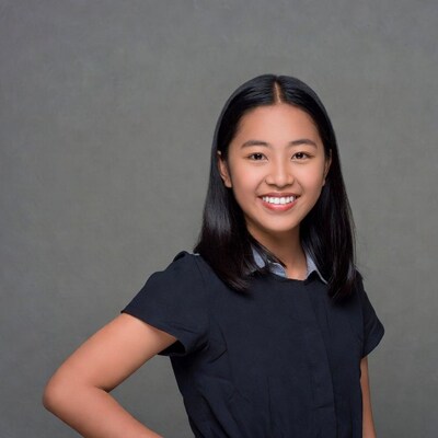 Asian girl smiling in black shirt