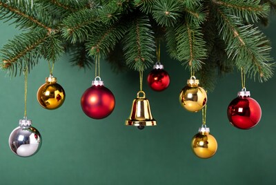 Christmas ornaments hanging from fir branches