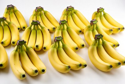 Fresh yellow bananas on white background