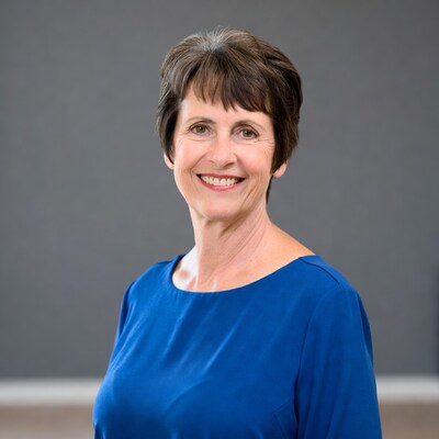 Smiling woman in blue dress