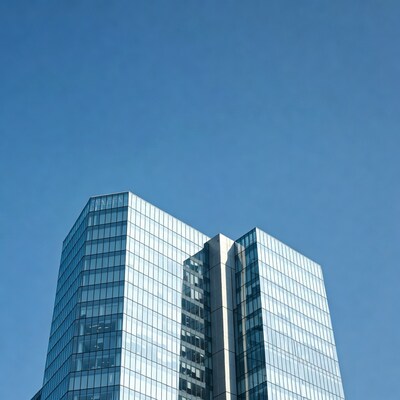 Modern glass skyscrapers against blue sky