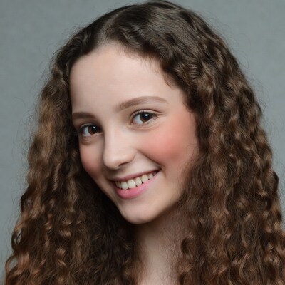Smiling girl with curly brown hair