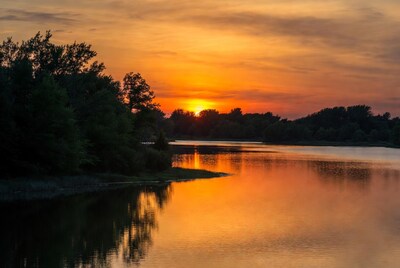 Sunset over lake with trees