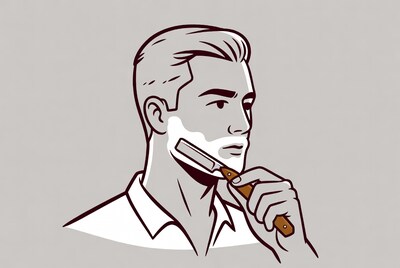 Man shaving with straight razor