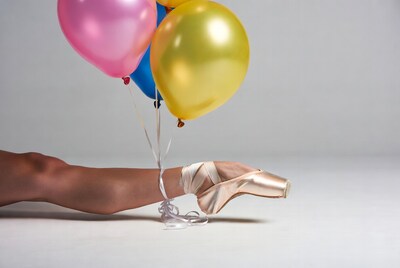 Ballerina foot with colorful balloons