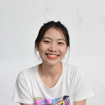 Smiling Asian woman in graphic t-shirt