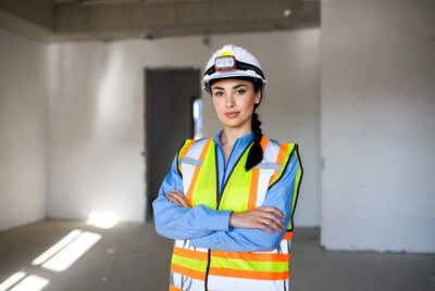 Female engineer in hard hat and vest