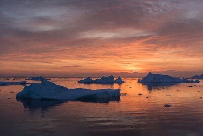 Icebergs in sunset Arctic waters