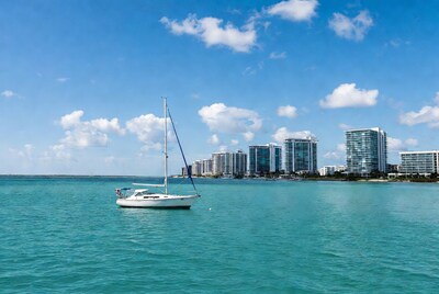 White sailboat anchored in turquoise water