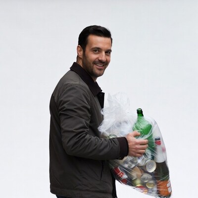 Man holding bag of recycling