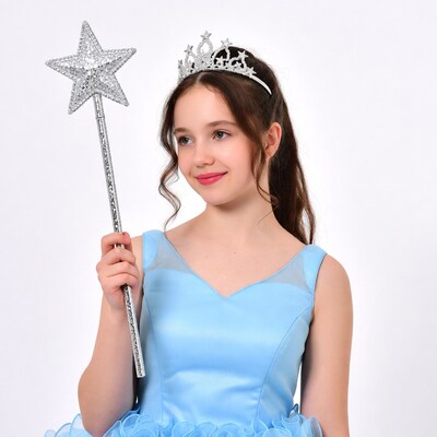 Girl holding magic wand and tiara