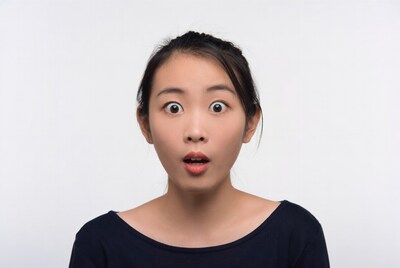 Asian woman with surprised expression