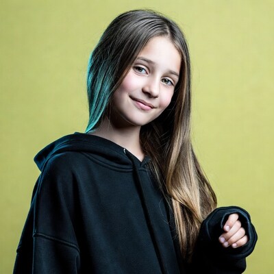 Girl smiling in black hoodie