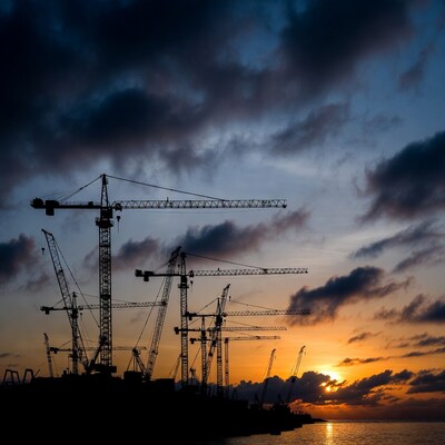 Construction Cranes Silhouette at Sunset