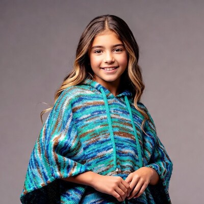 Girl in colorful knitted hoodie poncho