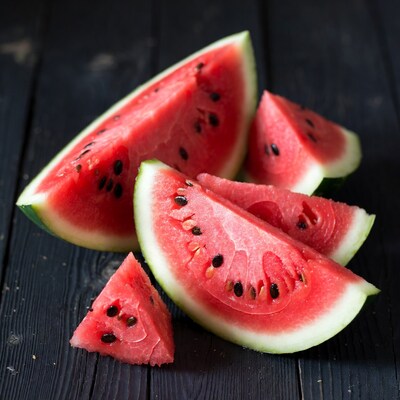 Fresh watermelon slices on wood