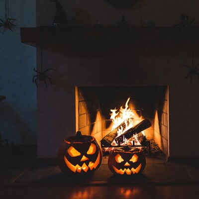 Jack-o-lanterns by fireplace