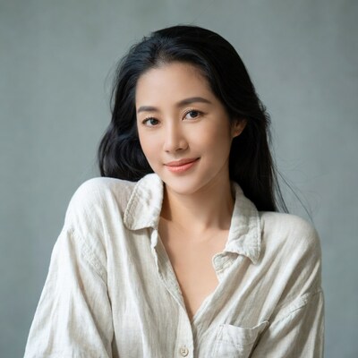Asian woman smiling in white shirt