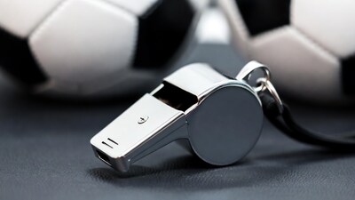 Silver whistle with soccer balls